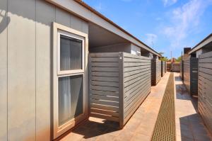 a row of windows on the side of a building at Stylish Studio 1x1 Walk to CBD in Port Hedland