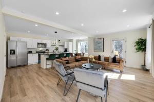 a large living room with a couch and a table at Elegant 2 Story Bloomfield 3 Kings 2 Queens in Bloomfield