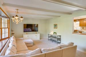 a living room with a couch and a tv at Private Pool and Home Theater Buchanan Family Home! in Buchanan