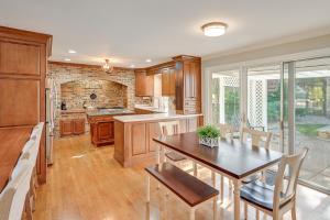a kitchen with a table and a dining room at Private Pool and Home Theater Buchanan Family Home! in Buchanan