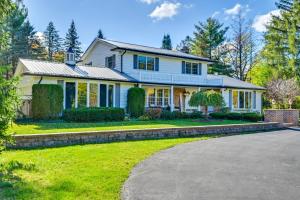 a large white house with a driveway at Private Pool and Home Theater Buchanan Family Home! in Buchanan