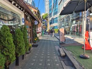 a cobblestone street in the middle of a city at 종로익선 스테이 in Seoul