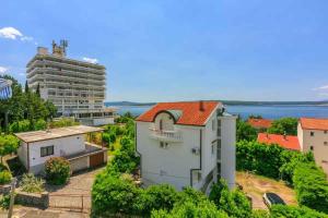 an aerial view of a building and a large building at Apartments in Dramalj 39393 in Dramalj