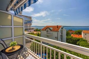 a balcony with a view of the ocean at Apartments in Dramalj 39393 in Dramalj