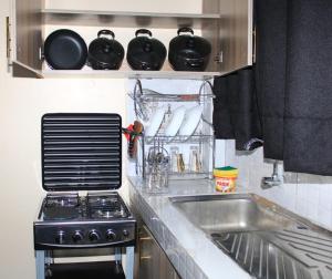 Кухня или мини-кухня в Wanjo Cozy Corner
