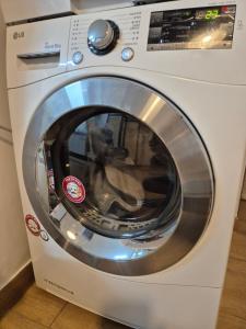 a washing machine is sitting in a room at 종로익선 스테이 in Seoul