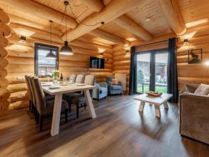 a dining room with a table and a couch at Jenig 1A in Jenig