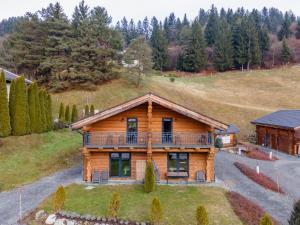 an aerial view of a log house with a balcony at Jenig 1A in Jenig