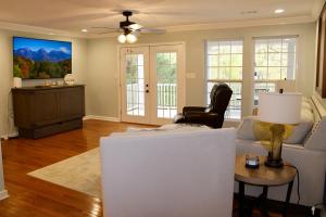 a living room with a couch and a chair at Riverfront Retreat in Walland