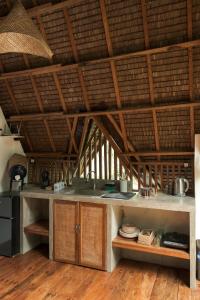 a kitchen with a counter top in a room at Pahinga Villas Siargao in Libertad