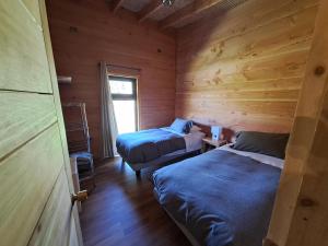 Ένα ή περισσότερα κρεβάτια σε δωμάτιο στο Wehuilli Puelo