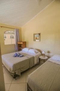 Postel nebo postele na pokoji v ubytování Casa Maju Suítes + 155 fotografií