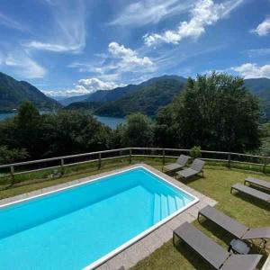 a swimming pool with a view of the mountains at Apartments in Pur - Ledrosee 22640 in Pur