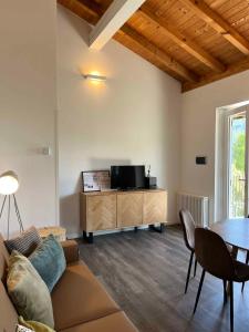 a living room with a couch and a table at Apartments in Pur - Ledrosee 22640 in Pur
