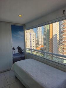 Ένα ή περισσότερα κρεβάτια σε δωμάτιο στο LIV INN Apartamento na Beira-Mar Fortaleza