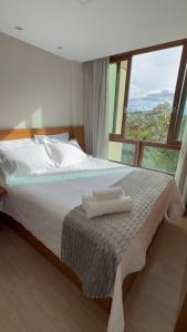 Ένα ή περισσότερα κρεβάτια σε δωμάτιο στο Apto completo no Vista Azul - Varanda com vista da Pedra Azul +28 φωτογραφίες
