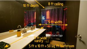 a bathroom with two sinks and a shower curtain at Easter Eggs in Rochester