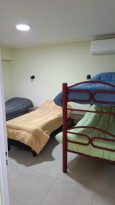 Postel nebo postele na pokoji v ubytování Departamentos x dia punta alta