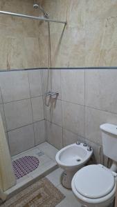 Koupelna v ubytování Departamentos x dia punta alta + 7 fotografií