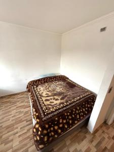 Ένα ή περισσότερα κρεβάτια σε δωμάτιο στο Departamento Don Leo +3 φωτογραφίες