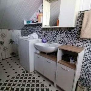 a bathroom with a sink and a toilet at Apartment in Crikvenica 53539 in Sopaljska