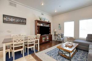 a living room with a table and a dining room at Downtown Pismo Beach modern updated single-level in Pismo Beach