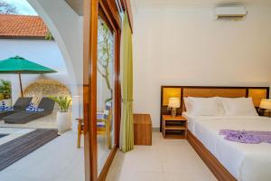 Giường trong phòng chung tại Nara Segara Canggu Villa +102 ảnh