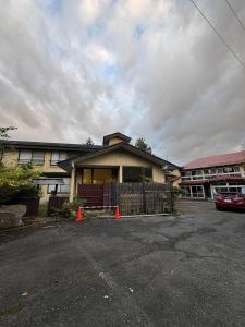 a house with two orange cones in front of it at Hygge KAWATABI in Osaki