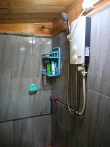 a shower in a bathroom with a shower at Bulan And Daud Homestay in Bario