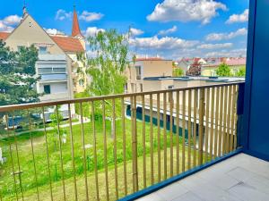 a balcony with a view of a building at Modern Apartment with Balcony near Vienna in Wiener Neudorf