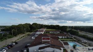 an aerial view of a town with a road and houses at Inn at Portland in Portland +15 photos