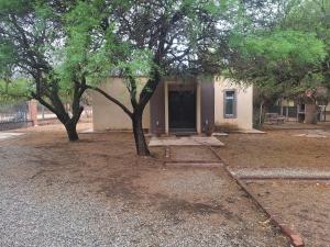 a house with a tree in front of it at Indigo CCH in Carpintería