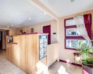 a kitchen with a counter and a window at Econo Lodge Galax in Galax +17 photos
