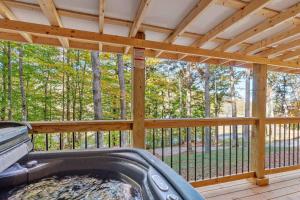 a screened in porch with a hot tub on a deck at Throw'n Shade at the Red - near RRG KY in Stanton +25 photos