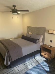 a bedroom with a large bed and a table at The Sandusky Melrose - Next to the Cedar Point Sports Center and Sports Force! Recently Renovated! in Sandusky