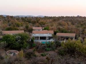 an aerial view of a house in the woods at Elements Bush Villa 295 in Mabula