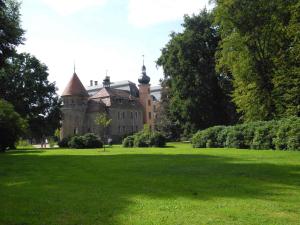 an old castle in a field of green grass at Apartments in Vetschau Spreewald 2618 in Vetschau