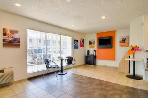 a room with a table and chairs and a window at Motel 6-Tacoma, WA - Fife in Fife