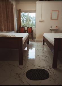 Giường trong phòng chung tại Dipti Retreat