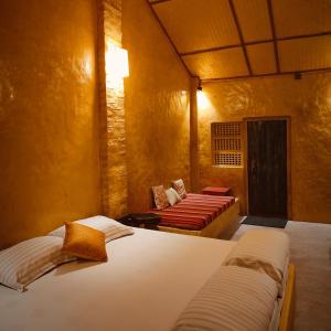 Postel nebo postele na pokoji v ubytování Sapoi Tea Farms 1914, Heritage Homestay