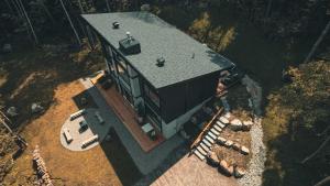 an overhead view of a house with a roof at Zen House 5 - Villas & Spa in Lac-Superieur +82 photos