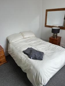 Una cama o camas en una habitación de Woodland Terrace