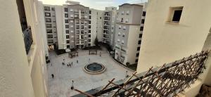 an overhead view of a courtyard in a apartment building at Modern & Comfortable Apartment in Aouina in El Aouina Station