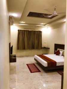 En eller flere senge i et værelse på Hotel Green valley resort