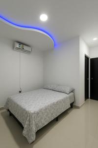 Ένα ή περισσότερα κρεβάτια σε δωμάτιο στο Toquipal Suites