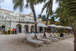 a row of chairs and umbrellas on a beach at Boracay Sands Hotel in Boracay