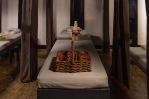 a table with two beds with a cake on it at Boracay Sands Hotel in Boracay
