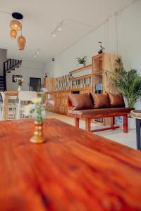 a living room with a couch and a table at Ark Guesthouse in Pai