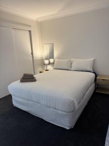 Ένα ή περισσότερα κρεβάτια σε δωμάτιο στο Walcha Villas