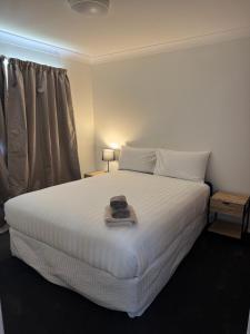 Ένα ή περισσότερα κρεβάτια σε δωμάτιο στο Walcha Villas